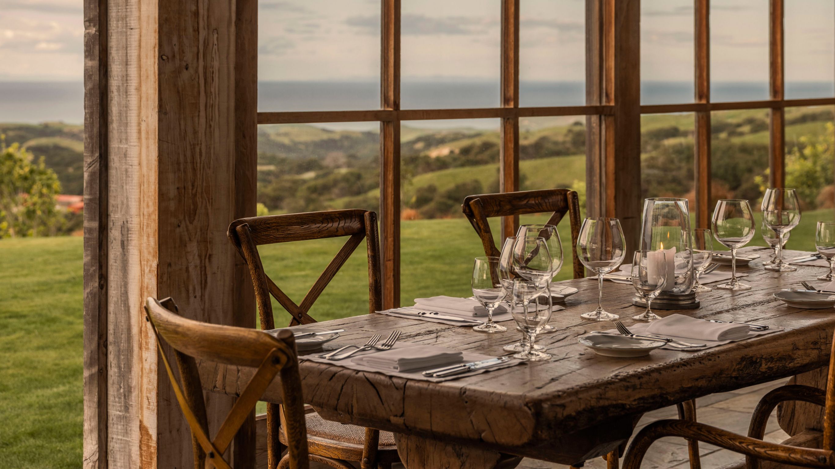 Interior view of loggia dining room looking out window to view beyond